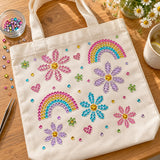 Tote bag decorated with rhinestone rainbows and flowers