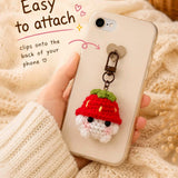 Crochet phone charm clipped onto the back of a phone