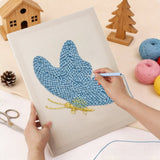 Punch needle kit showcasing a blue butterfly design being crafted by hand.