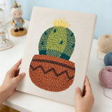 Punch needle kit showcasing a colorful cactus in a pot design, perfect for creative crafting projects.