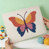 Punch needle kit artwork featuring a colorful butterfly design, showcasing vibrant textures.