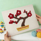 Finished punch needle kit artwork - Red Plum Bonsai design